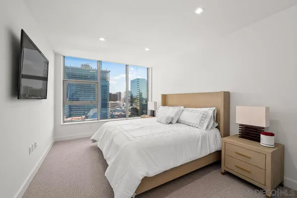 a bathroom with a double vanity sink toilet and shower