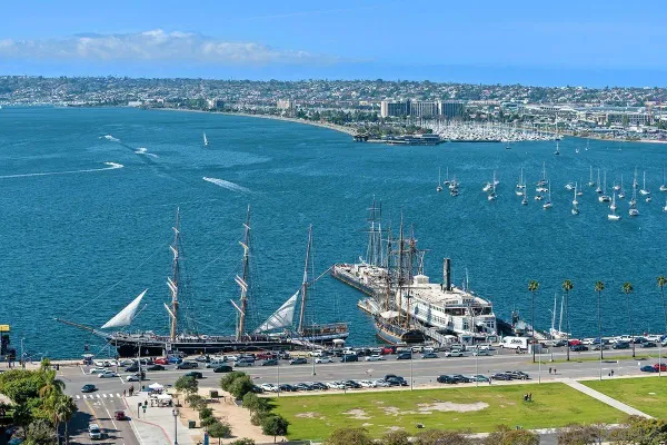 a living room with furniture a rug and a large window