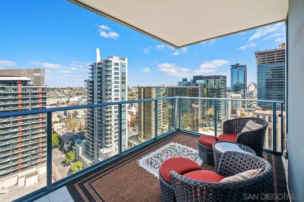 a view of a room with gym equipment and large mirror