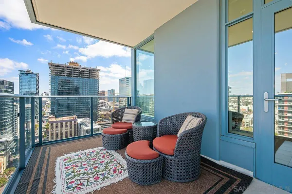 a very nice looking living room with a large window and a table