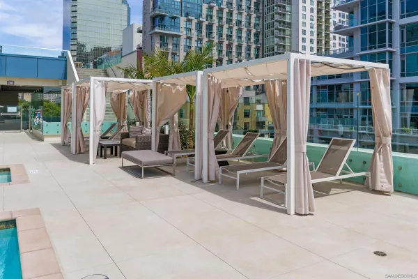 a view of a patio with couches and potted plants