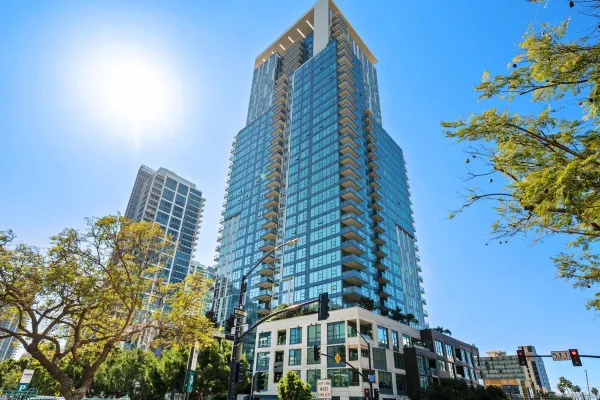 a view of a patio with dining table and chairs and potted plants