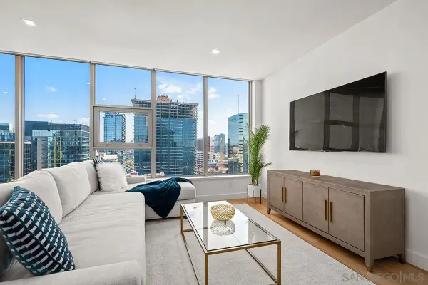 a living room with furniture and a flat screen tv