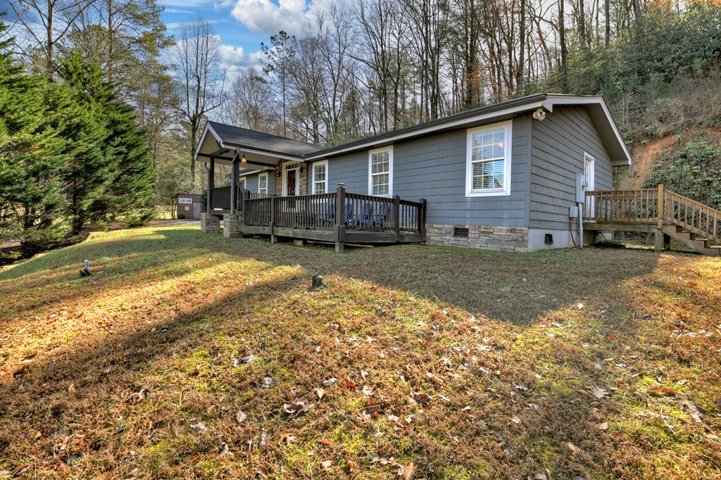 10266 Boardtown Road Cherry Log, GA 30522 - Photo 14 of 40 a view of a house with a yard