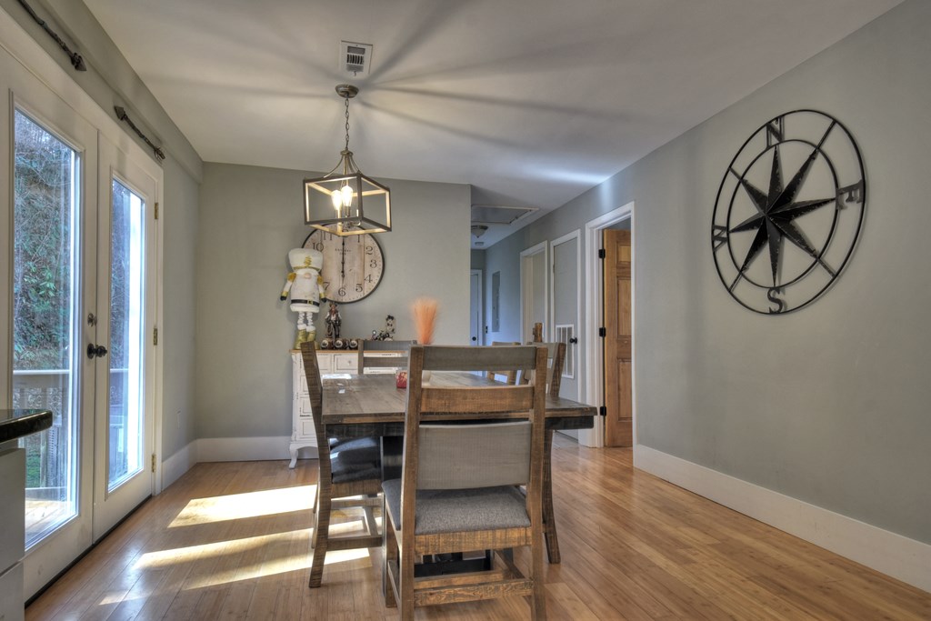 10266 Boardtown Road Cherry Log, GA 30522 - Photo 17 of 40 a view of a dining room with furniture window and wooden floor