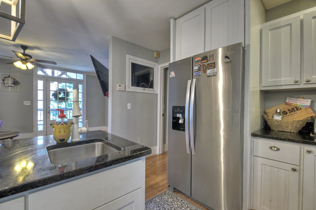 10266 Boardtown Road Cherry Log, GA 30522 - Photo 20 of 40 a kitchen with stainless steel appliances granite countertop a refrigerator and a sink