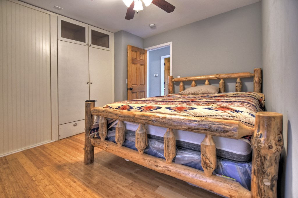 10266 Boardtown Road Cherry Log, GA 30522 - Photo 26 of 40 a bedroom with a bed and a chandelier