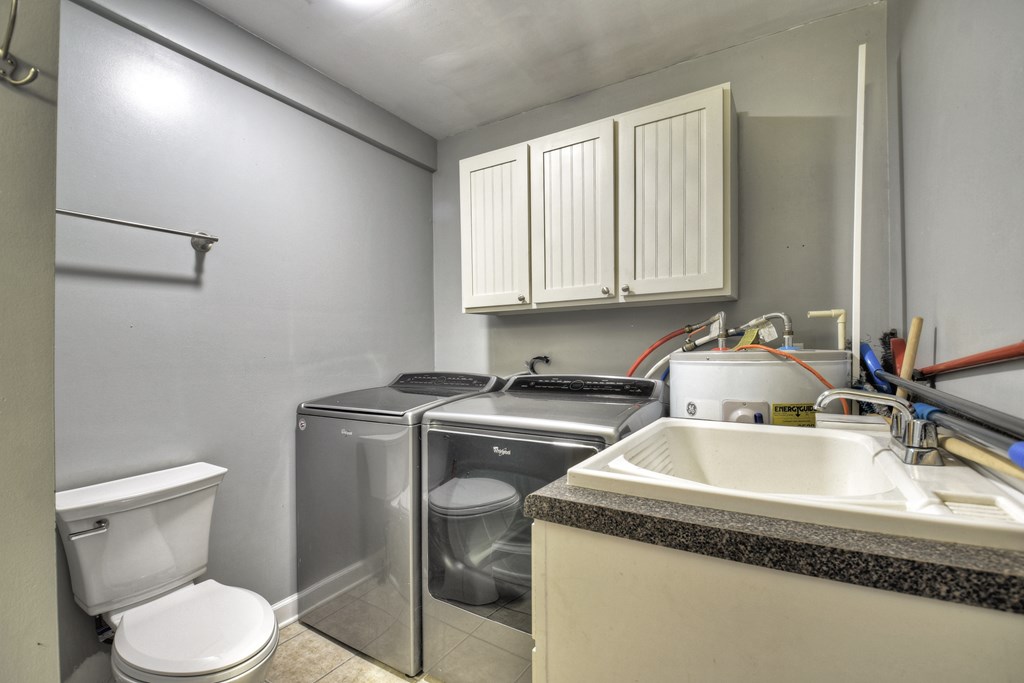 10266 Boardtown Road Cherry Log, GA 30522 - Photo 31 of 40 a room with a sink a toilet and a window