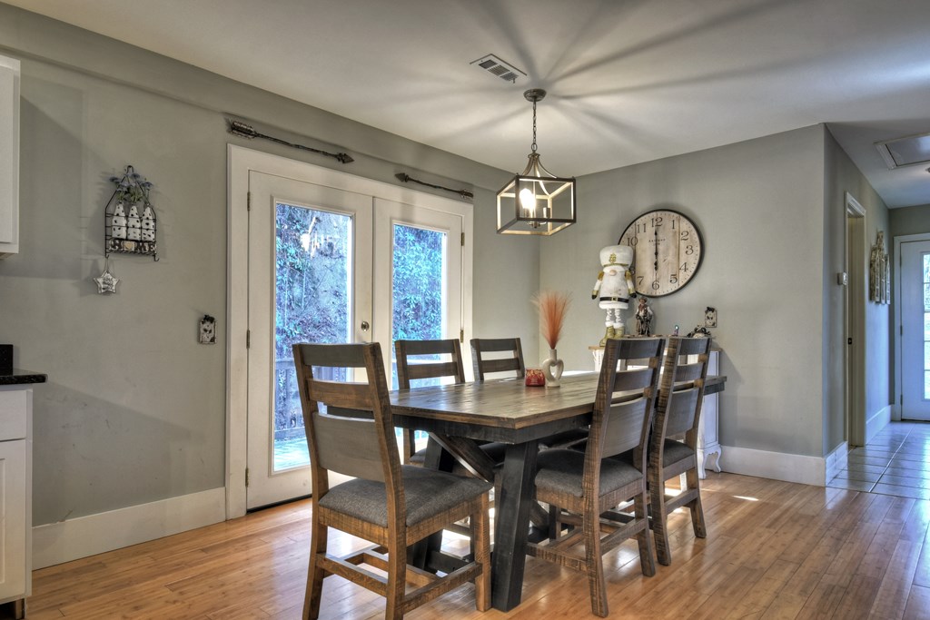 10266 Boardtown Road Cherry Log, GA 30522 - Photo 8 of 40 a view of a dining room with furniture window and wooden floor