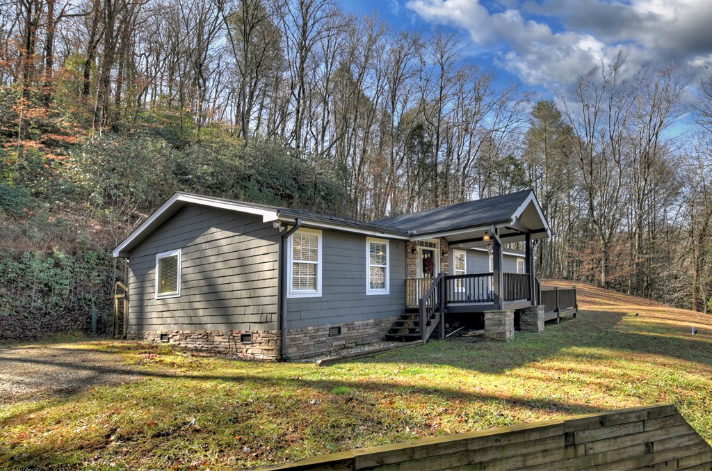 10266 Boardtown Road Cherry Log, GA 30522 - Photo 10 of 40 a view of a house with swimming pool and sitting area