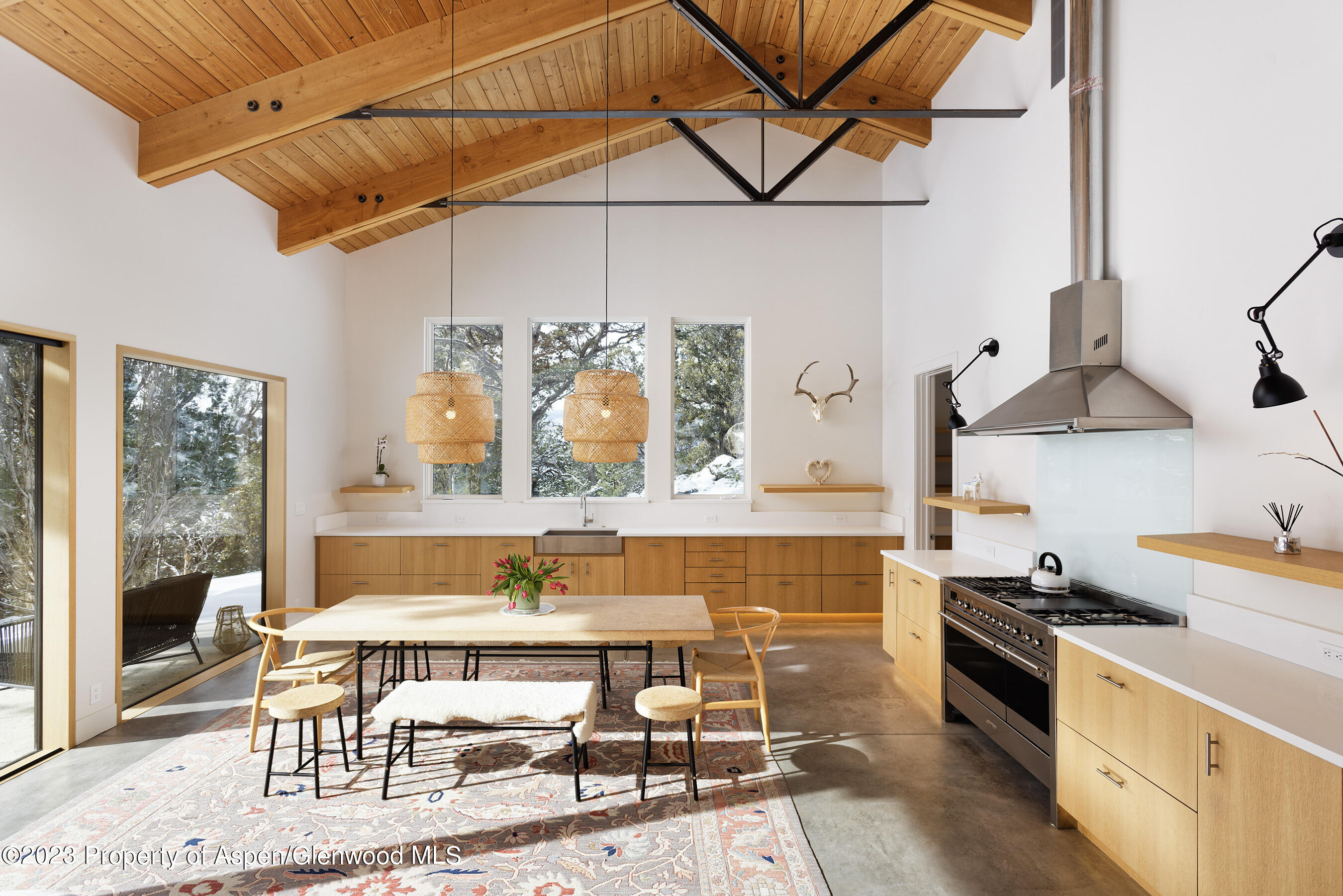 a kitchen with stainless steel appliances kitchen island granite countertop a stove a sink and a microwave