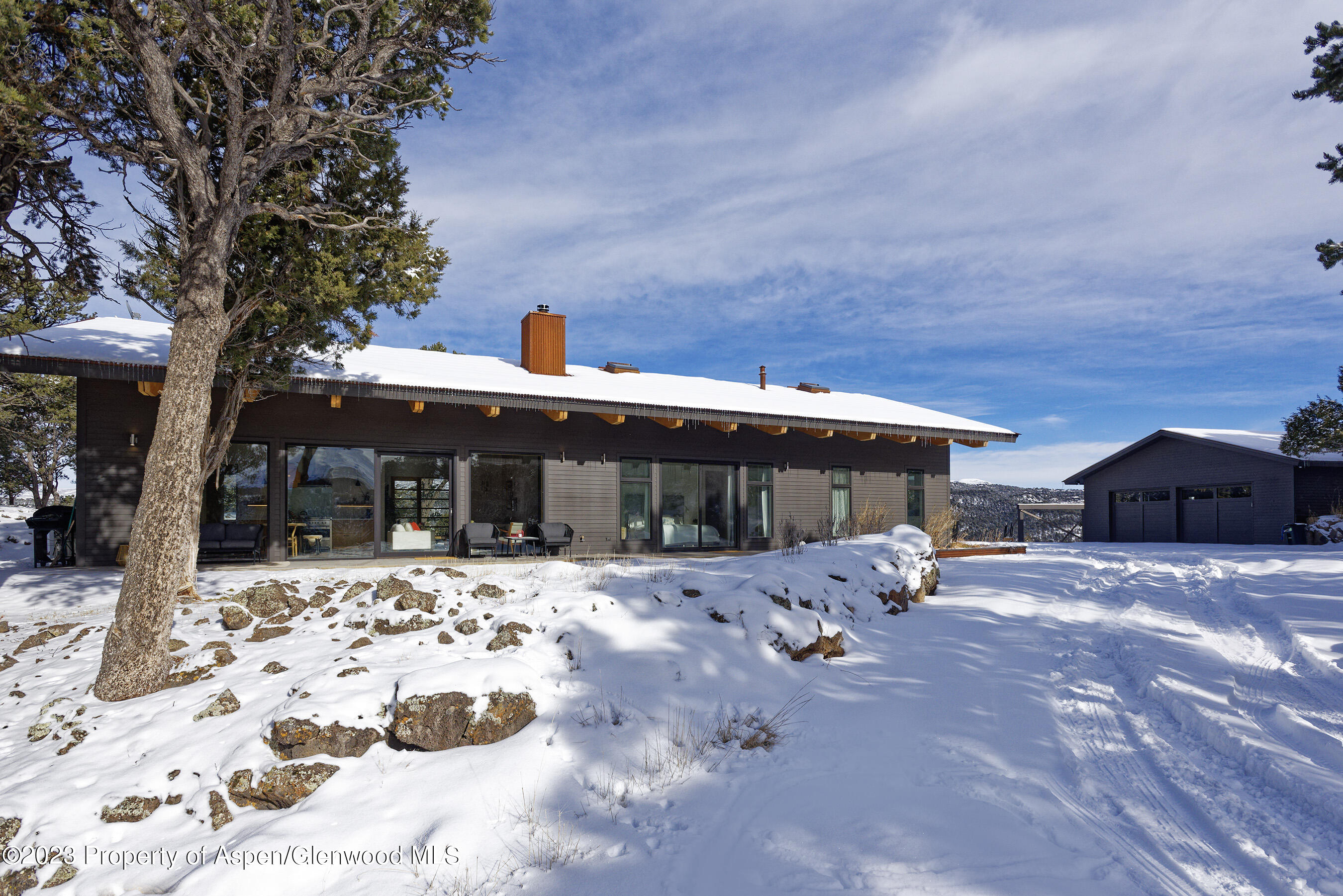 89 Sage Swale Road Carbondale, CO 81623 - Photo 22 of 23 a view of a house with a yard covered in snow
