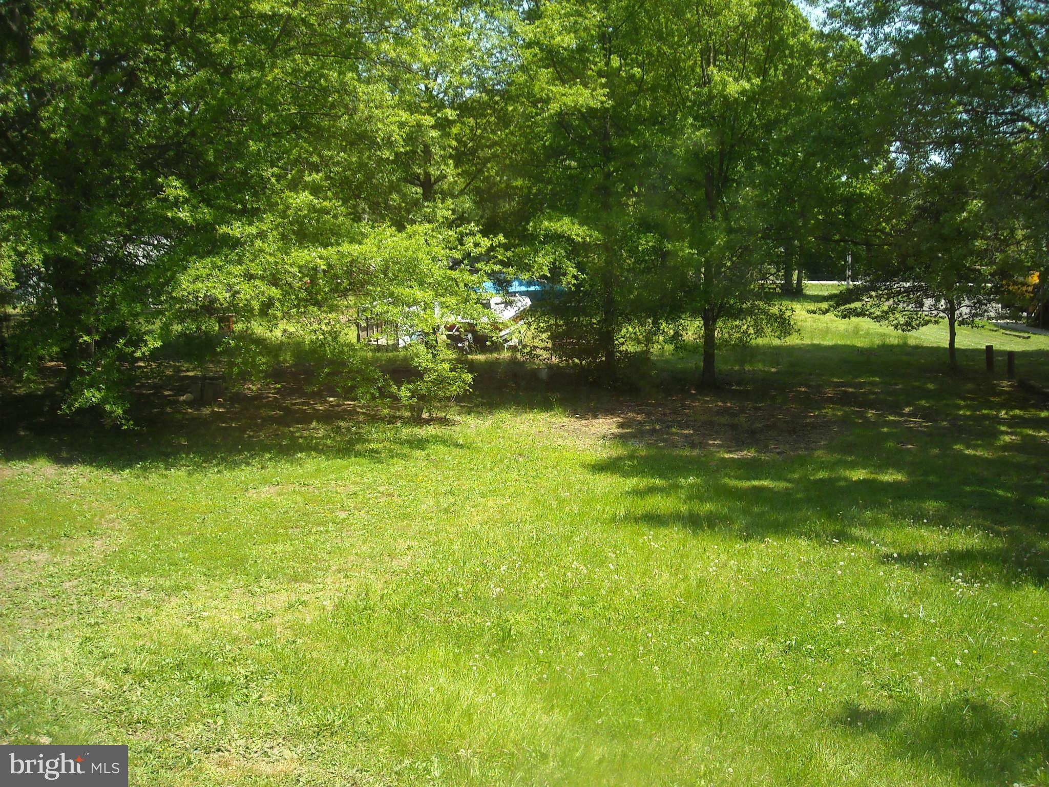 13630 Hamit Road Dowell, MD 20688 - Photo 11 of 12 a view of a green yard