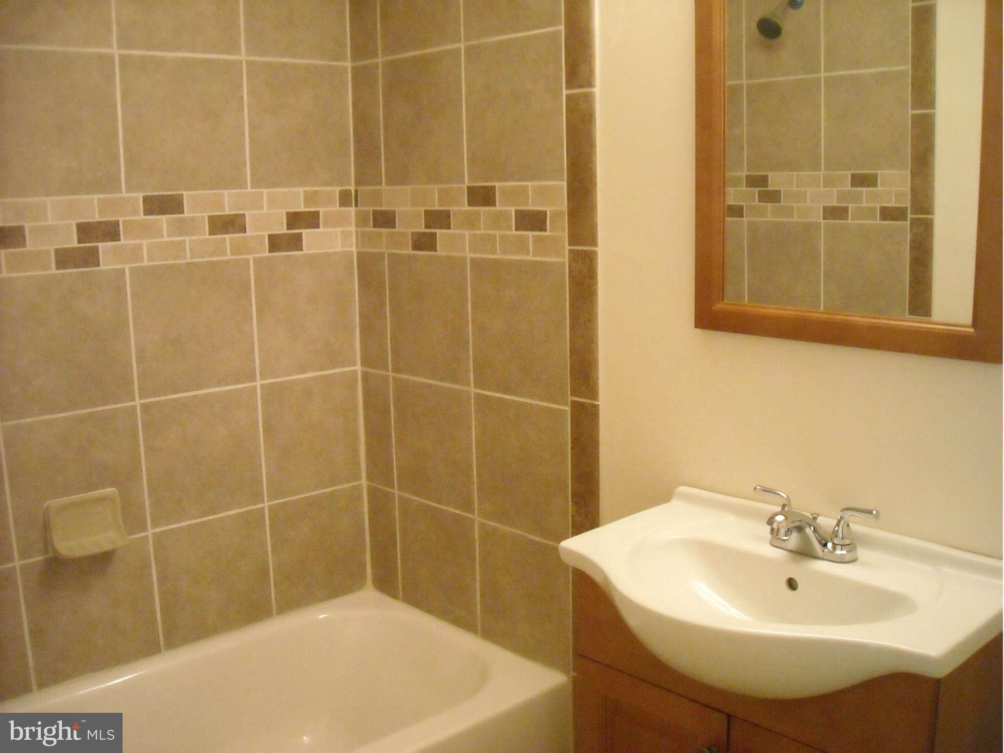 13630 Hamit Road Dowell, MD 20688 - Photo 4 of 12 a bathroom with a sink a shower