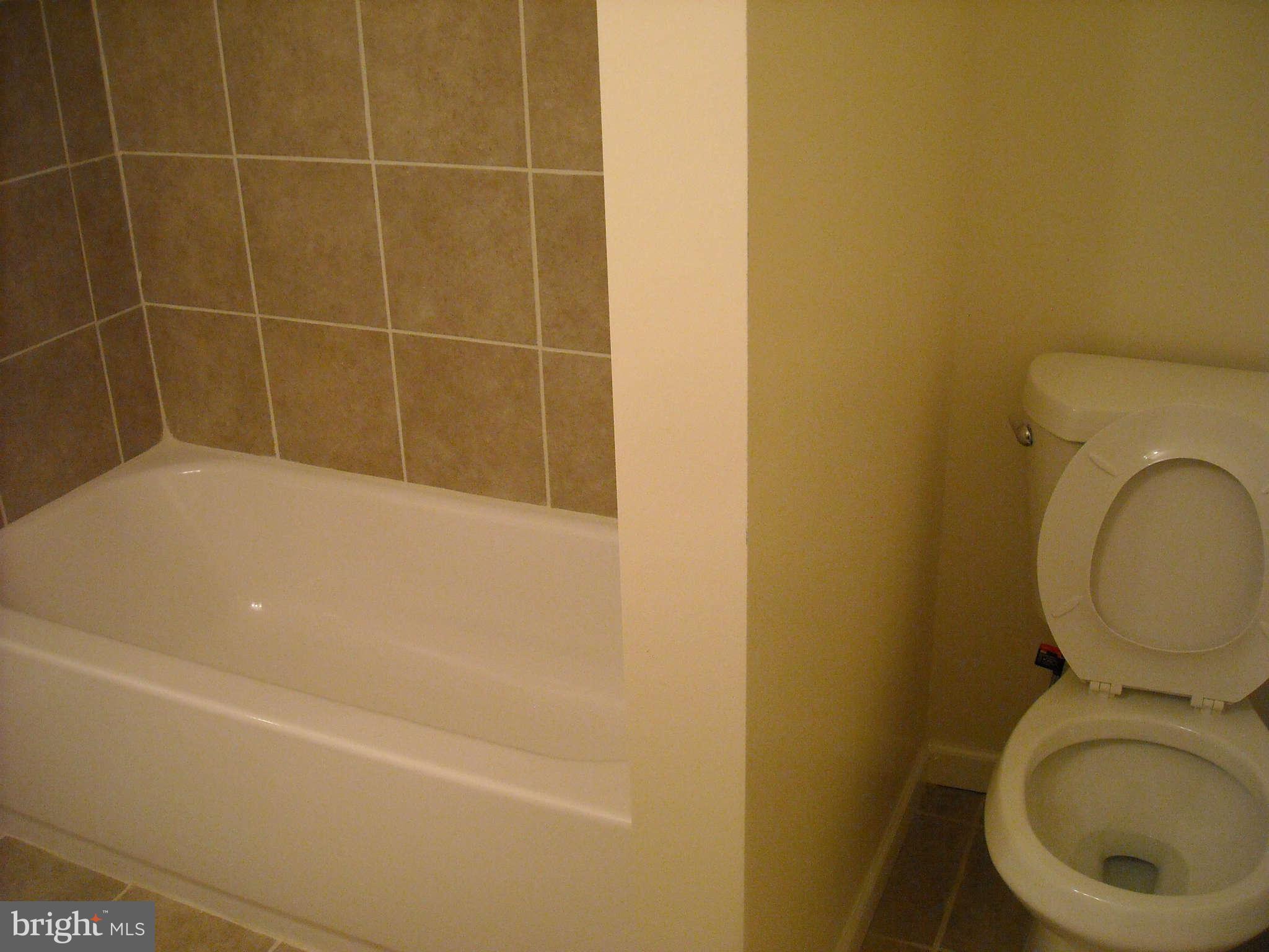 13630 Hamit Road Dowell, MD 20688 - Photo 7 of 12 a bathroom with a toilet and a sink