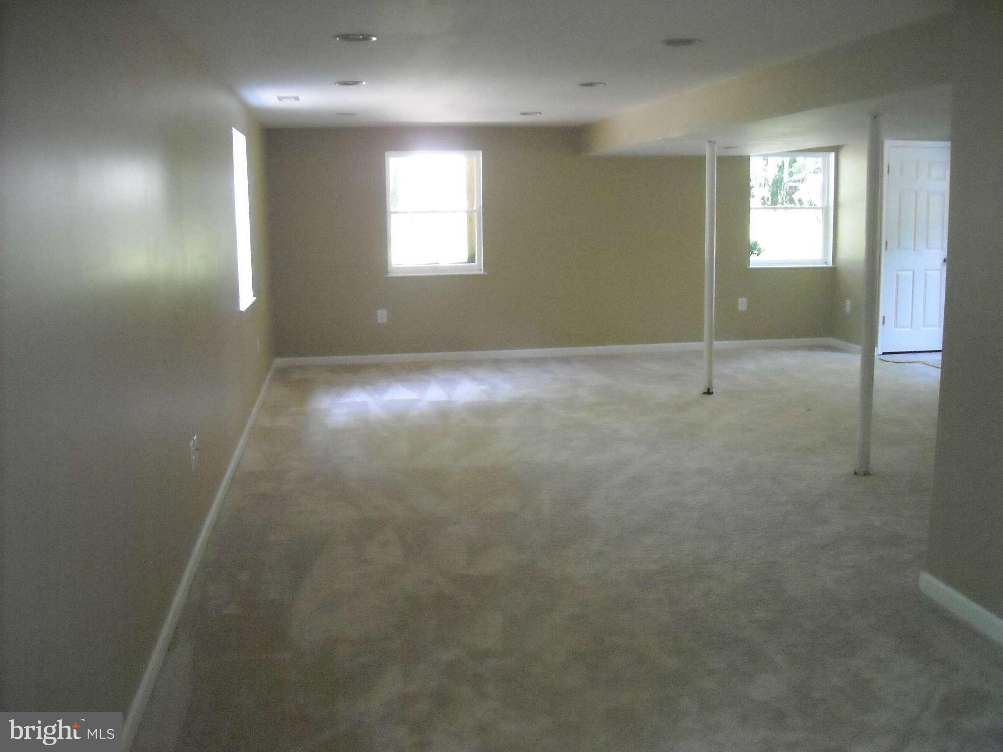 13630 Hamit Road Dowell, MD 20688 - Photo 8 of 12 an empty room with windows and closet