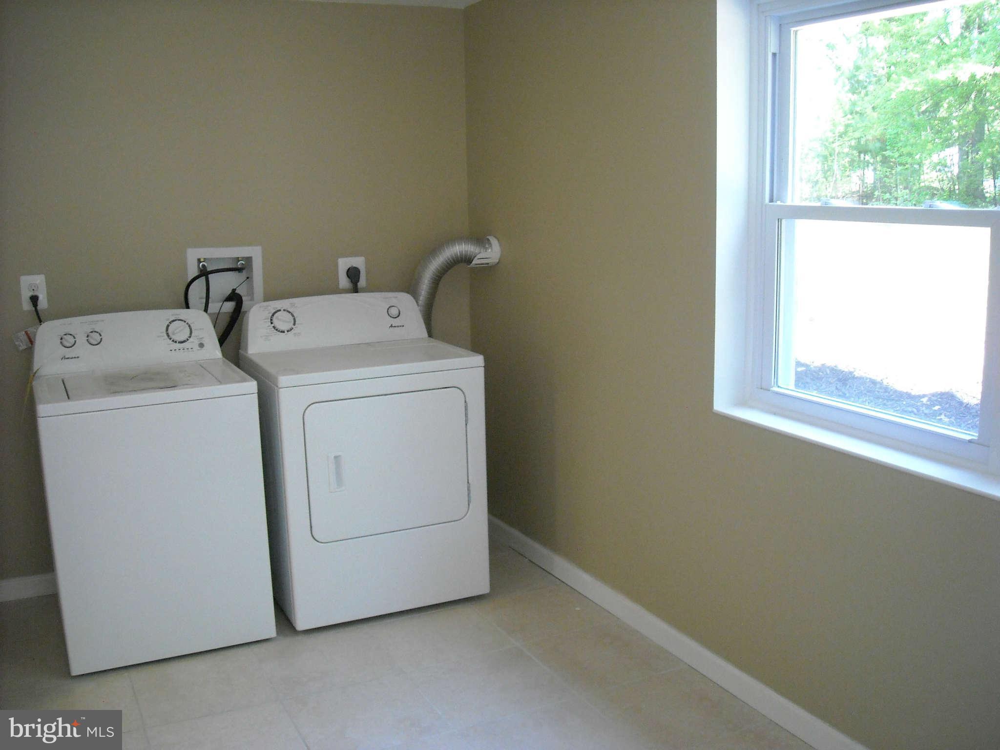 13630 Hamit Road Dowell, MD 20688 - Photo 9 of 12 a utility room with dryer and washer