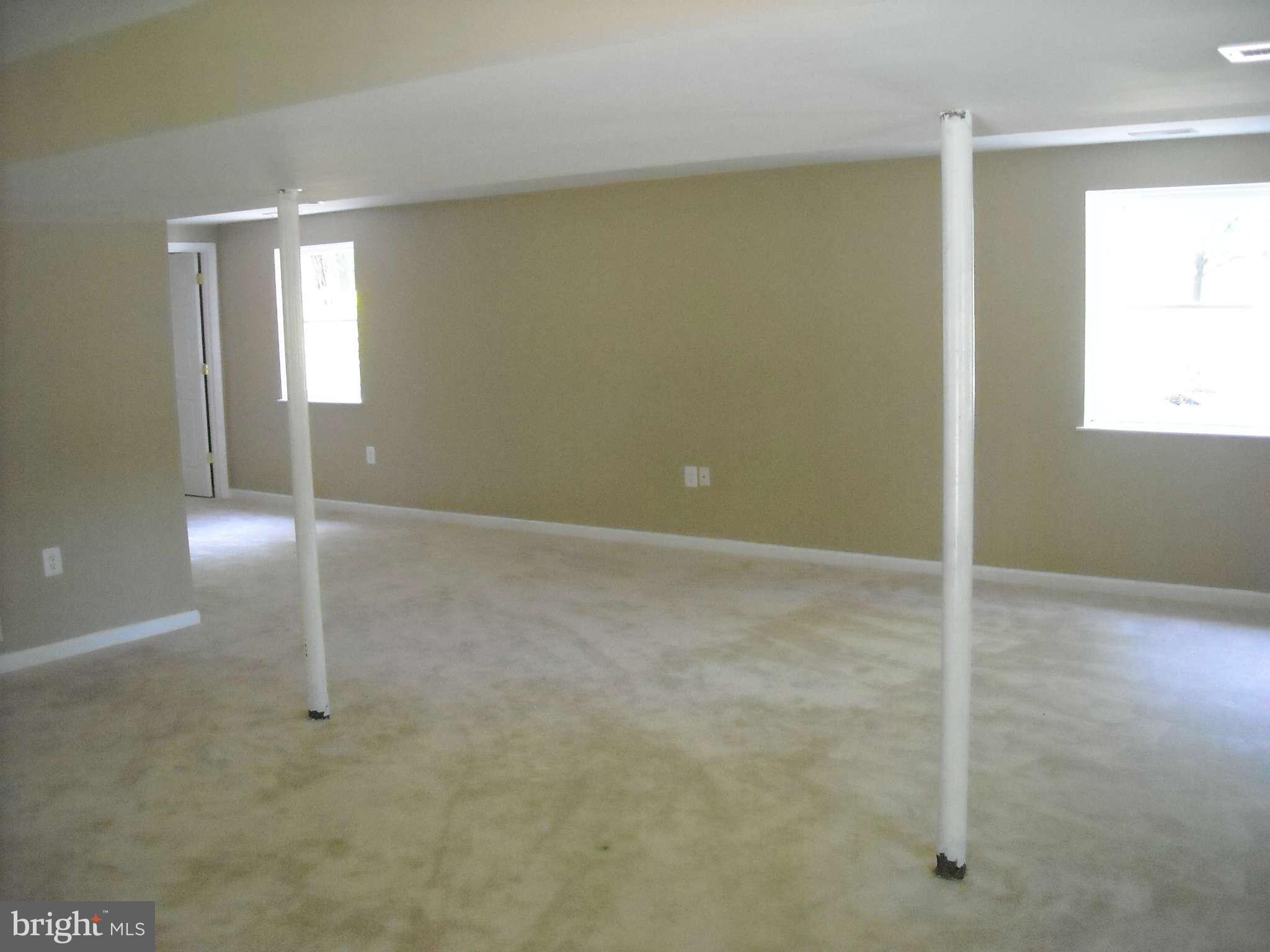 13630 Hamit Road Dowell, MD 20688 - Photo 10 of 12 an empty room with windows