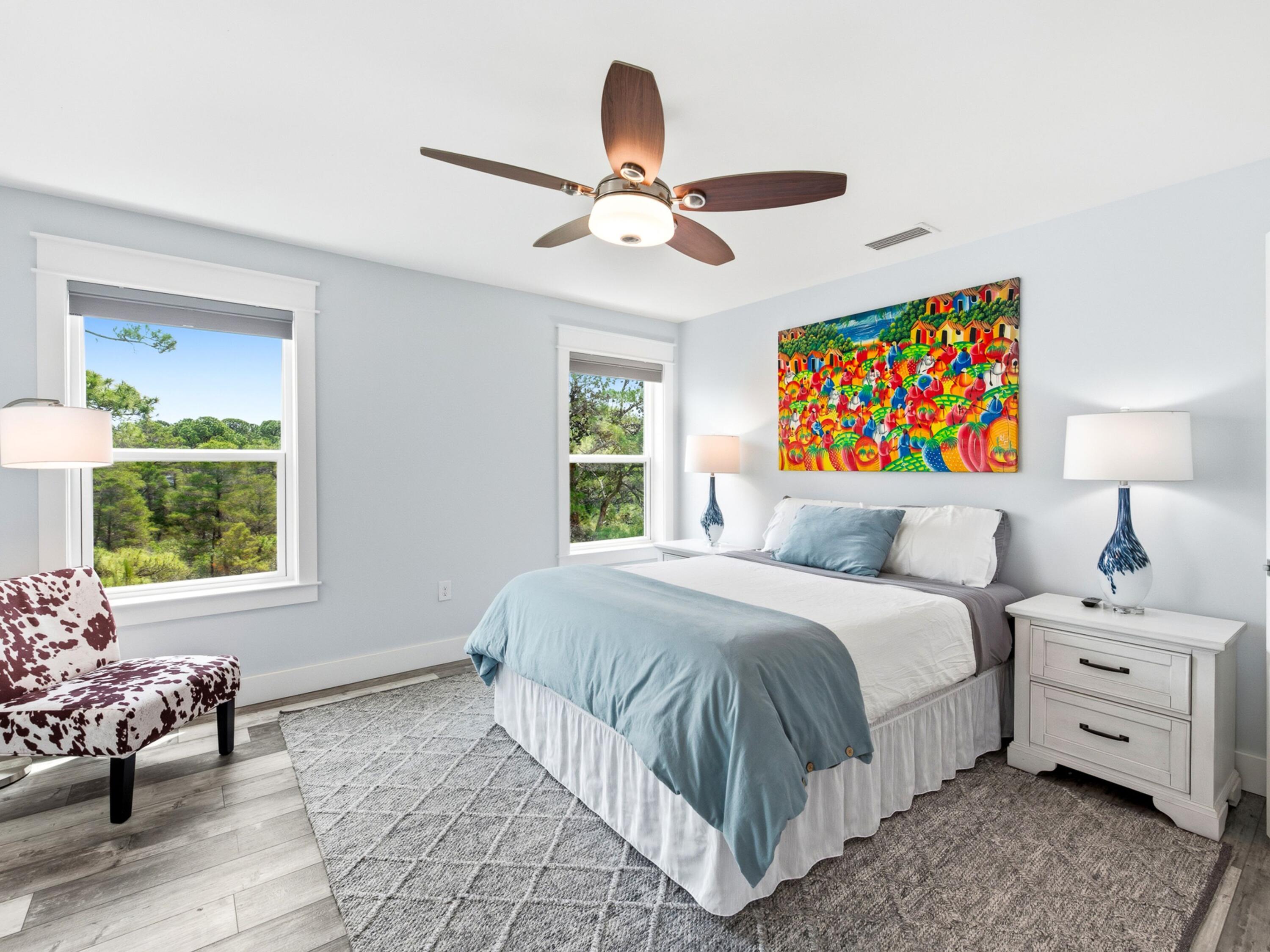 59 Conscience Way Santa Rosa Beach, FL 32459 - Photo 18 of 41 a bedroom with a bed and a chandelier