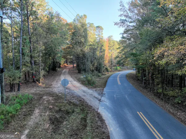 a view of a street with trees on both side of the road