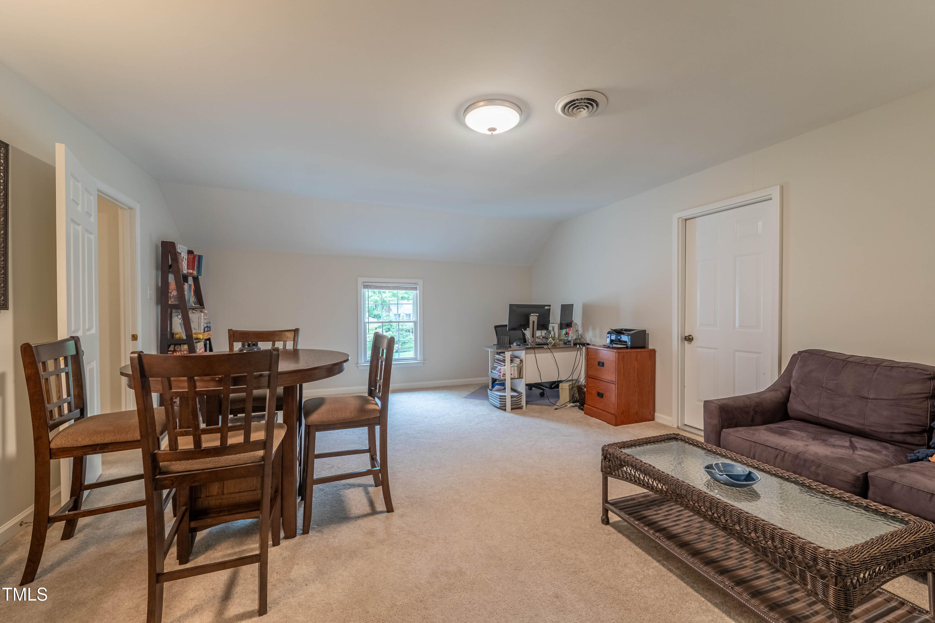 8604 Wellsley Way Raleigh, NC 27613 - Photo 38 of 52 a living room with furniture a air conditioner and a window