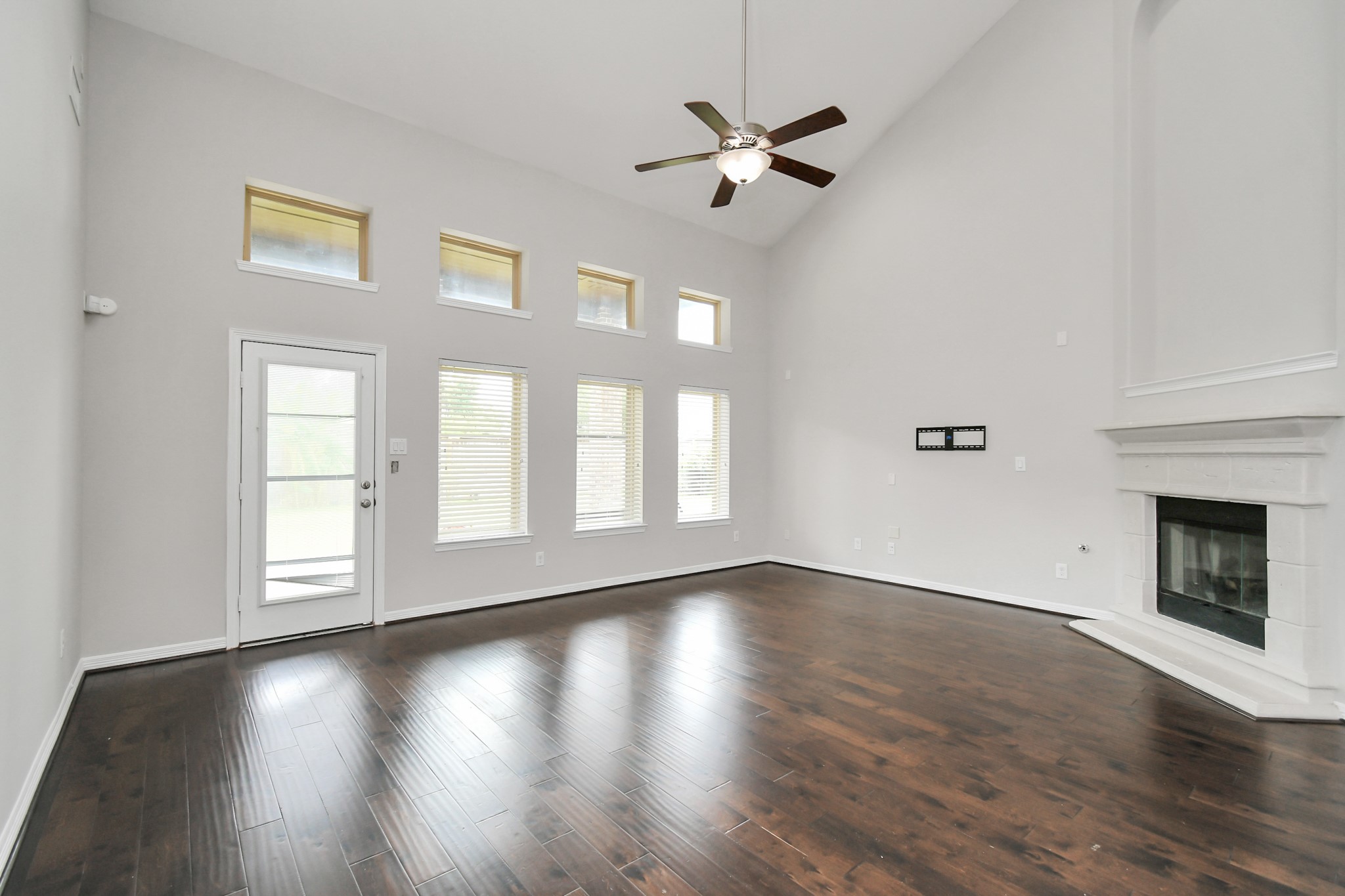 3803 May Ridge Lane Sugar Land, TX 77479 - Photo 12 of 47 a view of an empty room with wooden floor and a window