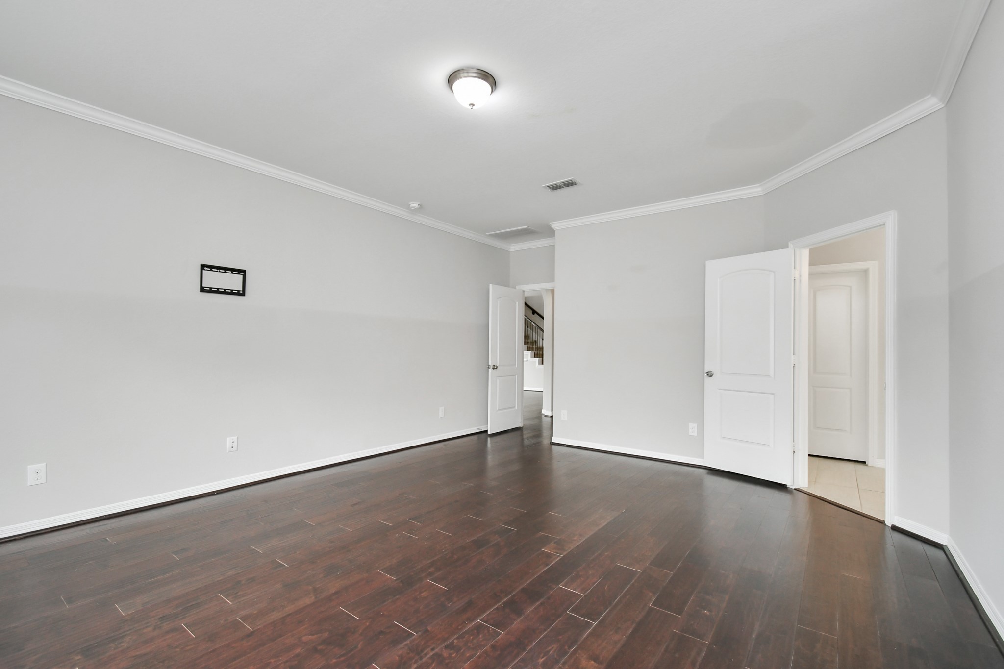 3803 May Ridge Lane Sugar Land, TX 77479 - Photo 14 of 47 a view of an empty room with wooden floor and a window