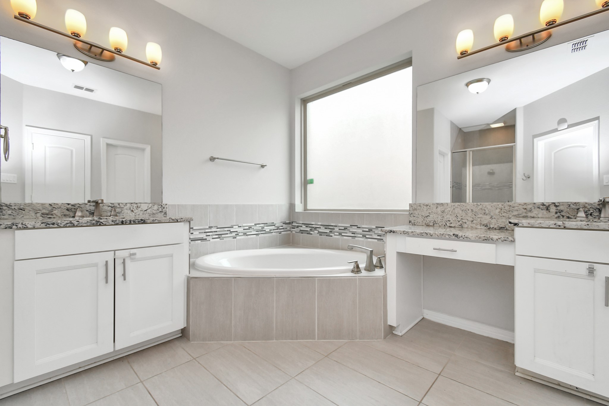 3803 May Ridge Lane Sugar Land, TX 77479 - Photo 16 of 47 a bathroom with a granite countertop sink and a mirror
