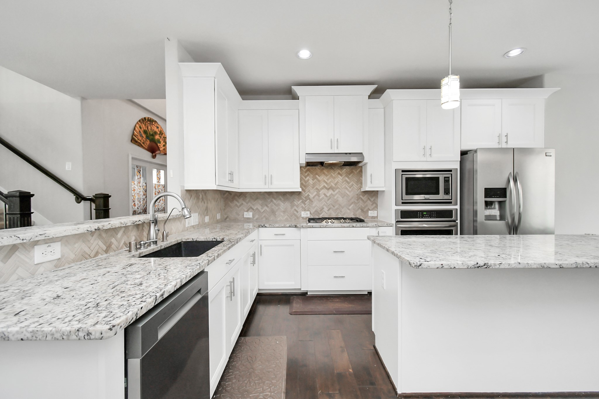 3803 May Ridge Lane Sugar Land, TX 77479 - Photo 21 of 47 a kitchen with granite countertop a sink a counter space appliances and cabinets