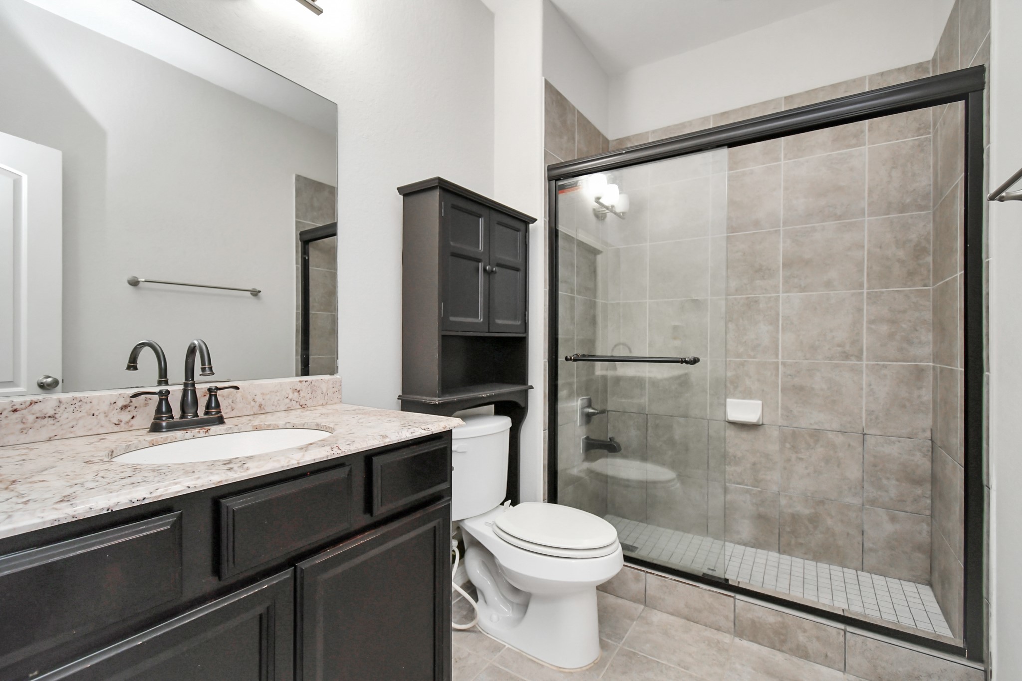 3803 May Ridge Lane Sugar Land, TX 77479 - Photo 29 of 47 a bathroom with a granite countertop sink toilet and shower