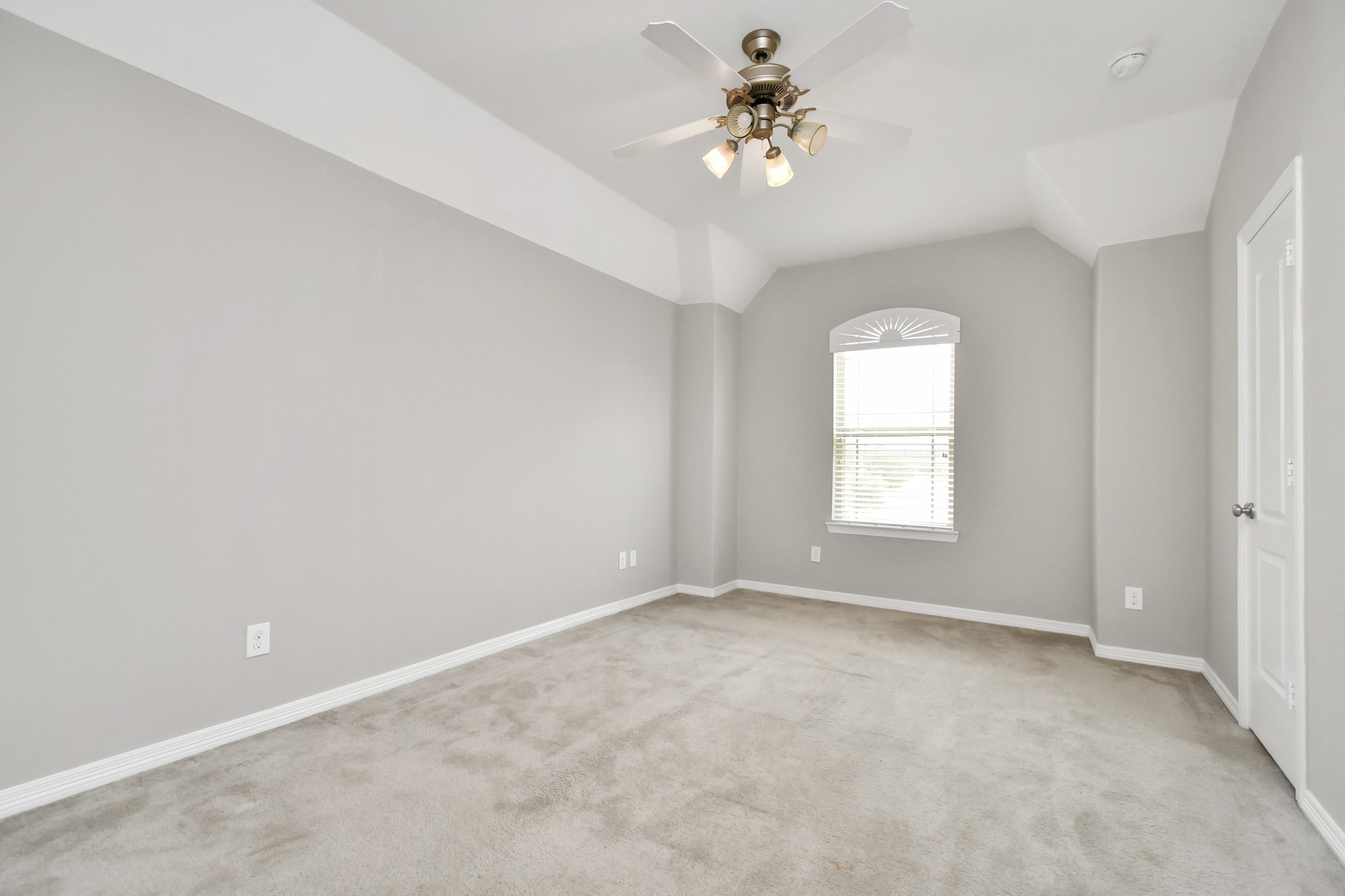 3803 May Ridge Lane Sugar Land, TX 77479 - Photo 38 of 47 an empty room with a chandelier fan and windows