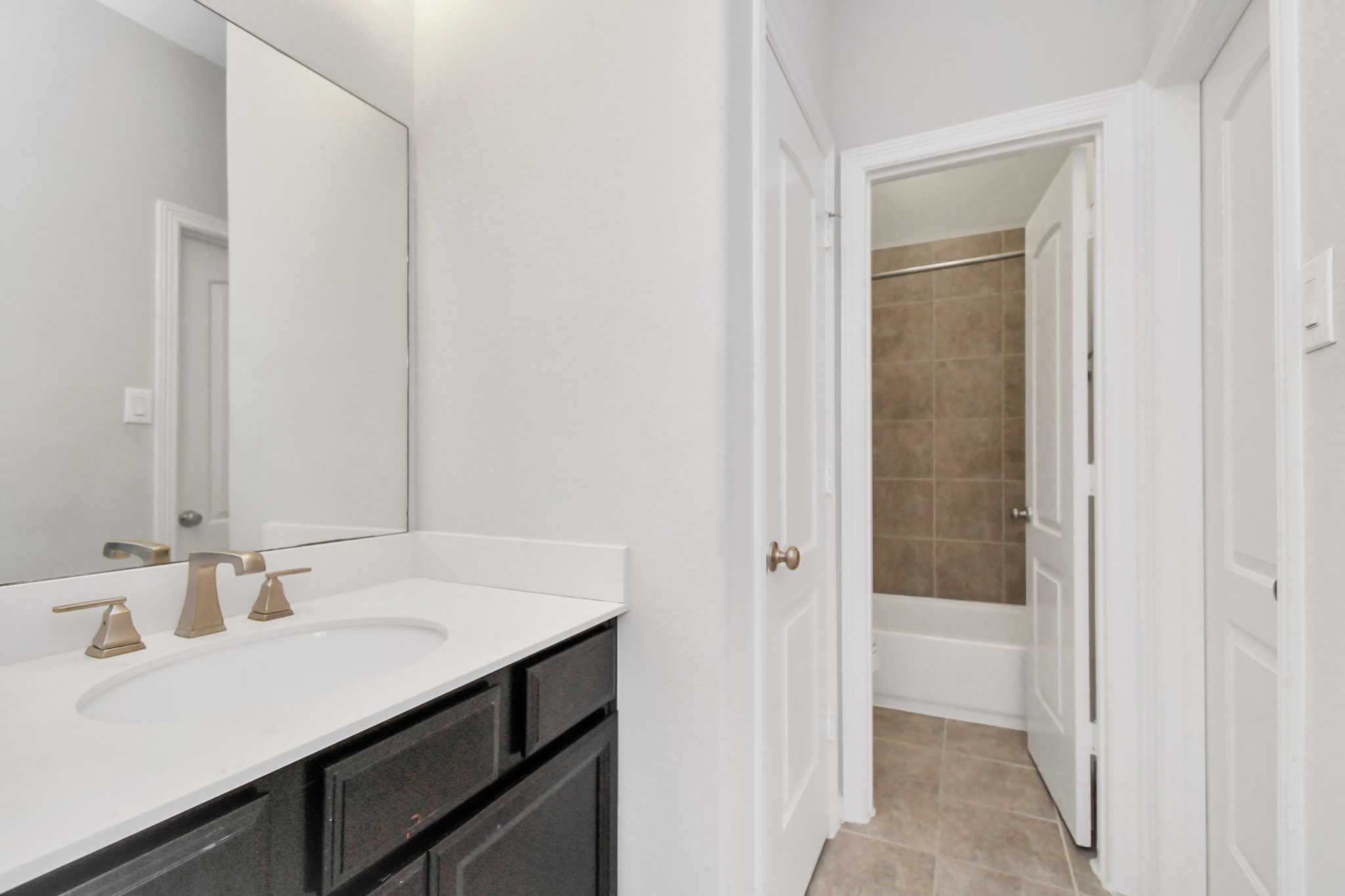 3803 May Ridge Lane Sugar Land, TX 77479 - Photo 43 of 47 a bathroom with a sink a mirror and a shower