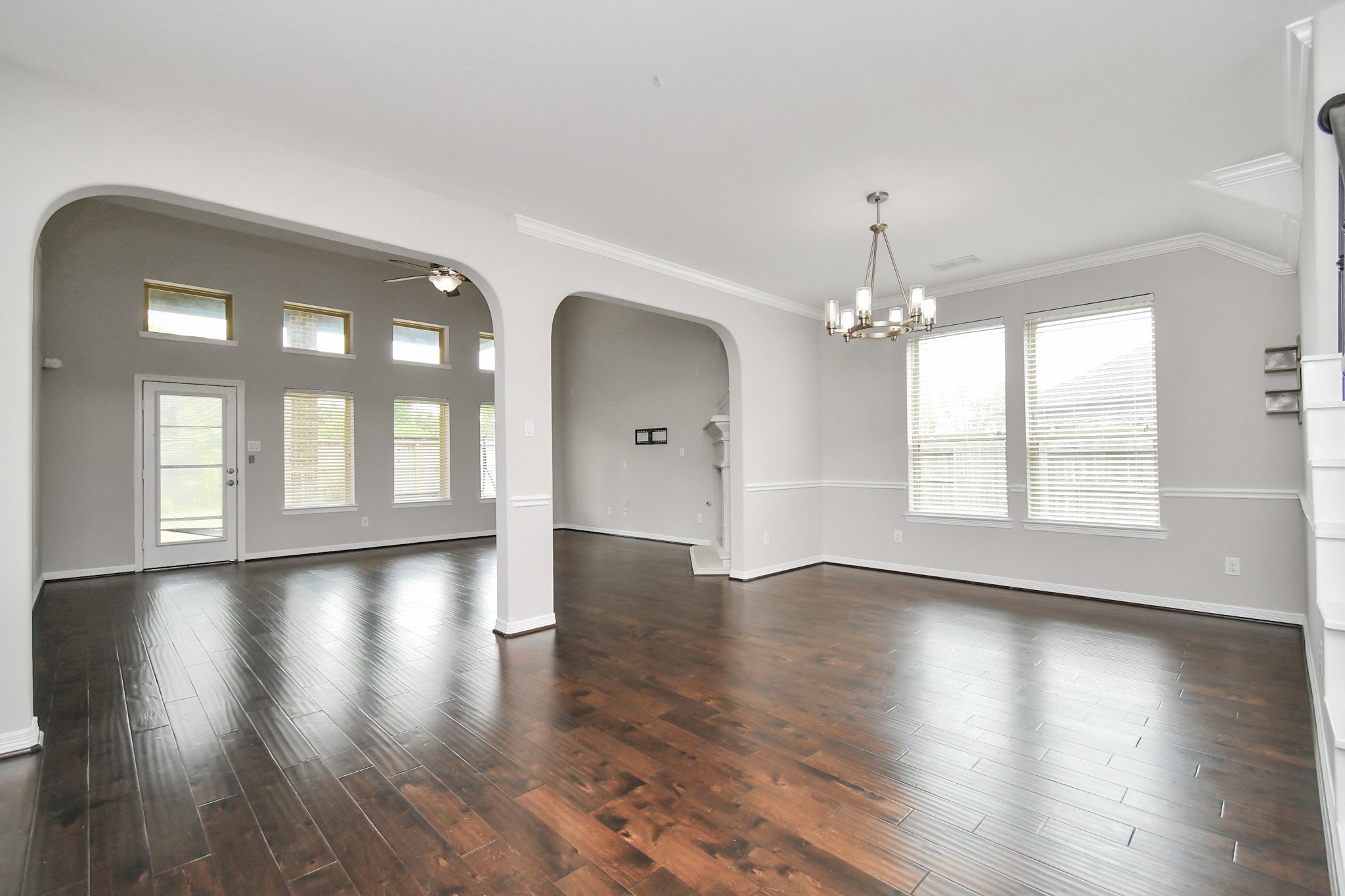 3803 May Ridge Lane Sugar Land, TX 77479 - Photo 7 of 47 a view of an empty room with wooden floor and a window