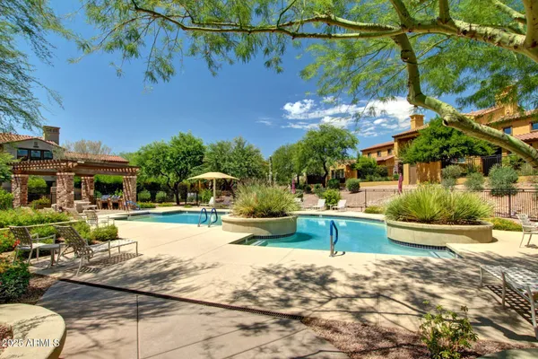 a view of a swimming pool with a patio