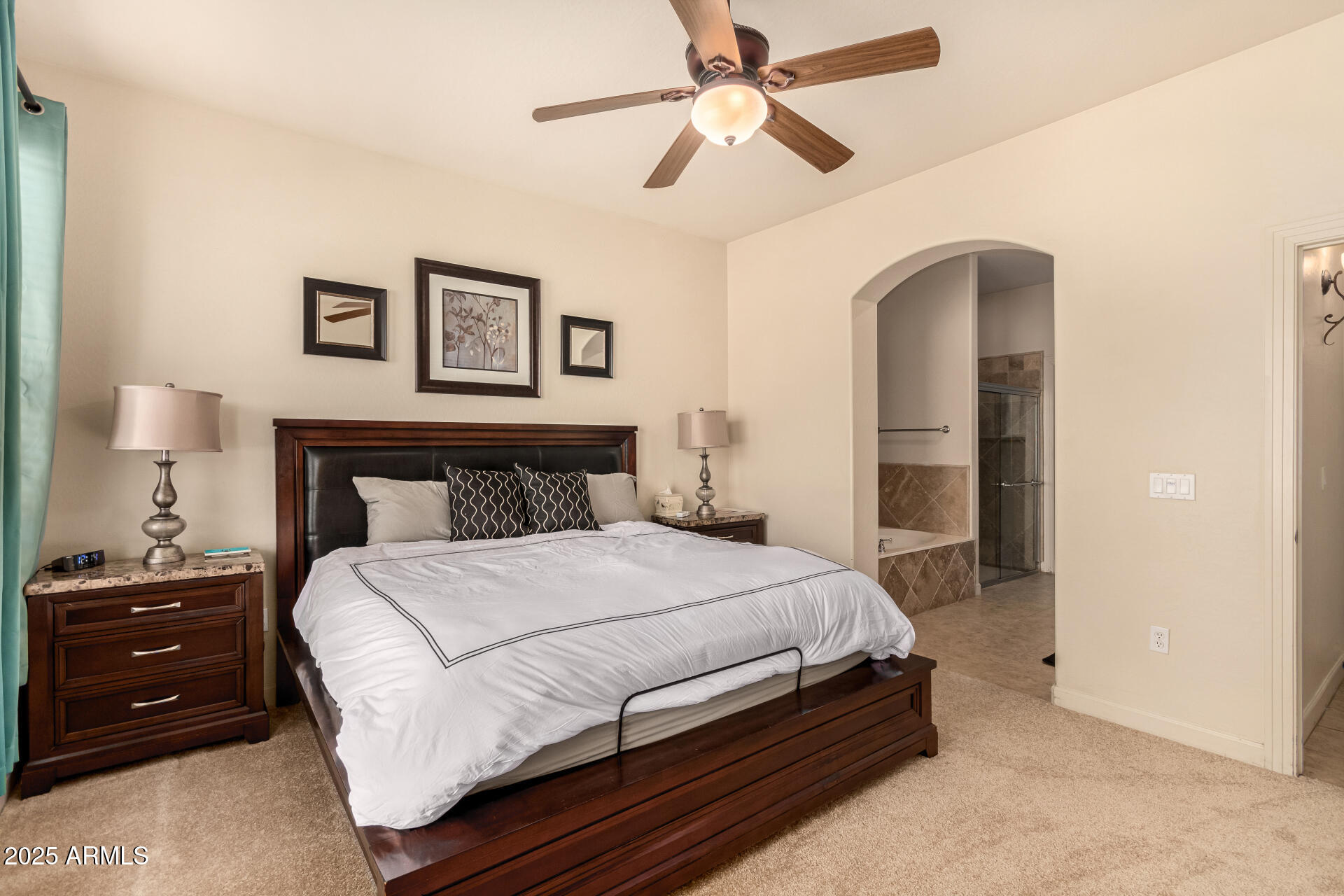 20750 North 87th Street, Unit 1065 Scottsdale, AZ 85255 - Photo 13 of 29 a bedroom with a bed and a lamp on a dresser