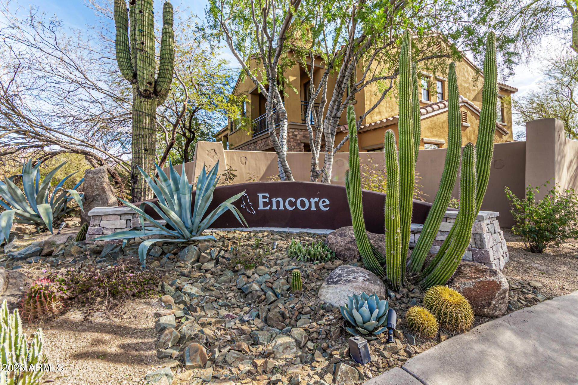 20750 North 87th Street, Unit 1065 Scottsdale, AZ 85255 - Photo 2 of 29 a view of a sign under a tree