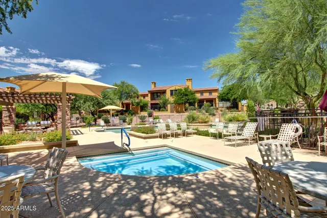 a view of a swimming pool with a patio