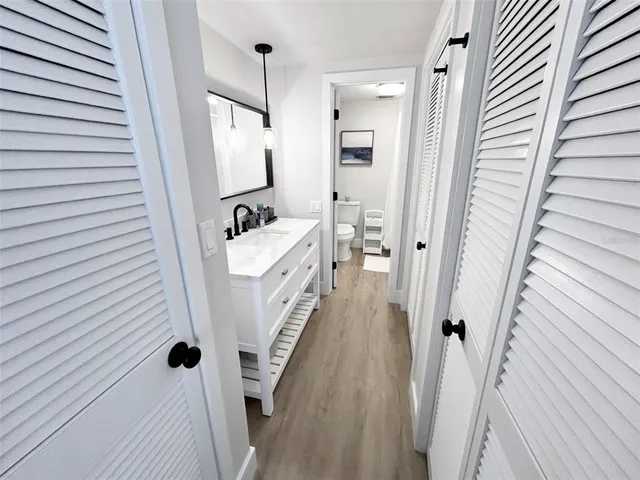 a bathroom with a sink a mirror and a shower