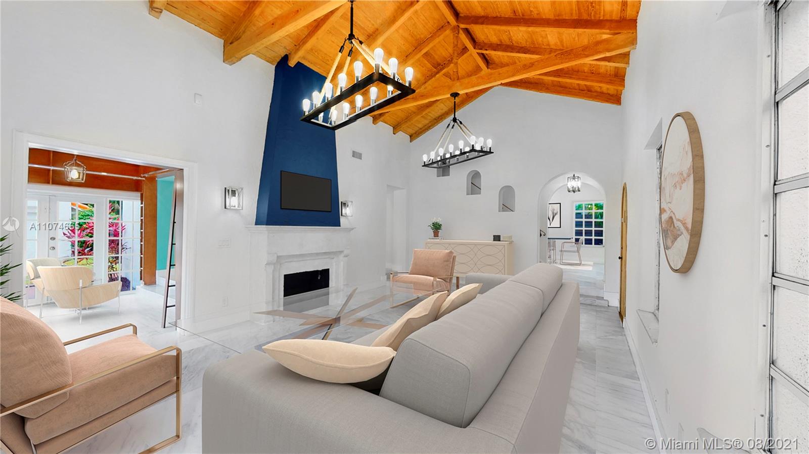 2032 Alton Road Miami Beach, FL 33140 - Photo 12 of 35 a living room with furniture a flat screen tv and a fireplace