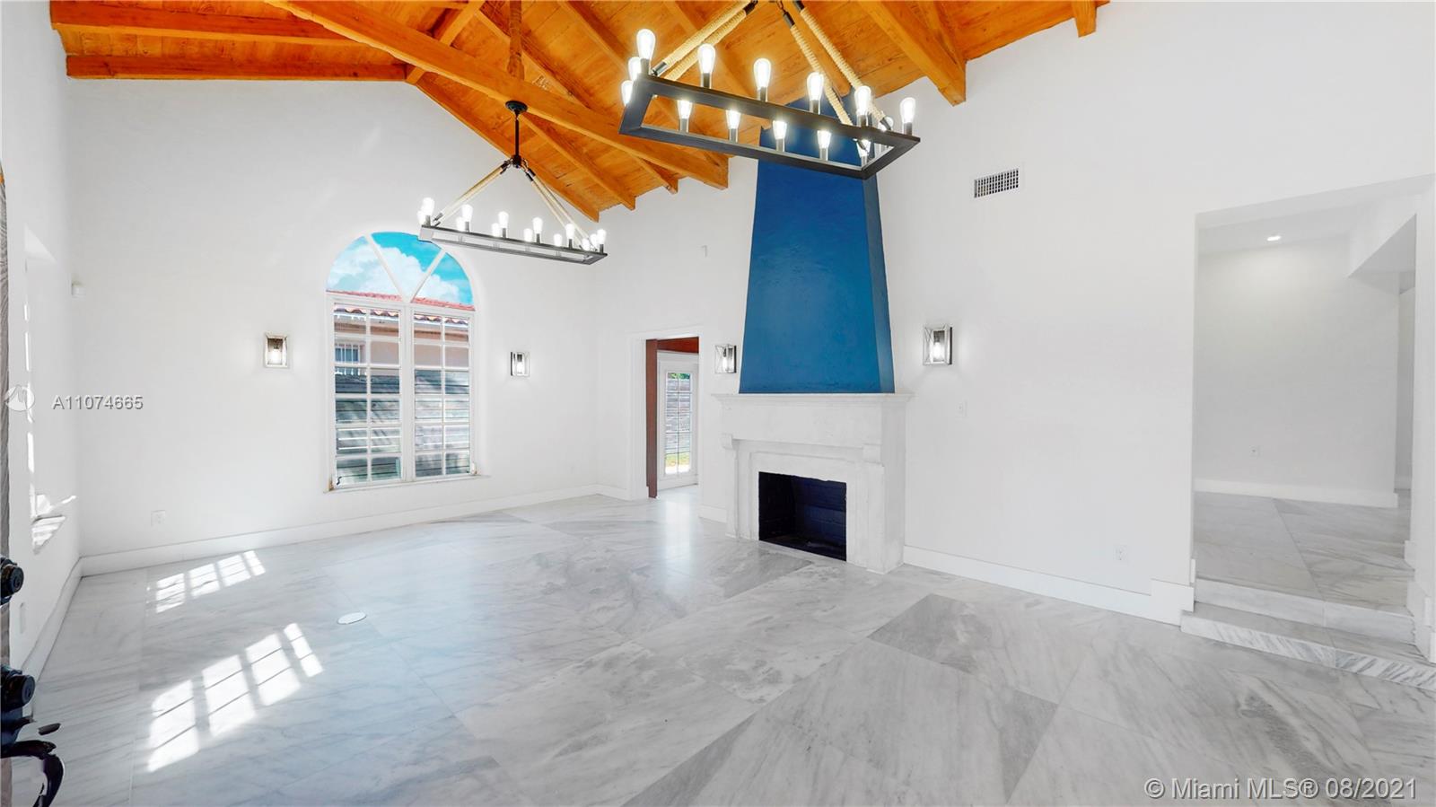 2032 Alton Road Miami Beach, FL 33140 - Photo 13 of 35 a view of an empty room with a fireplace