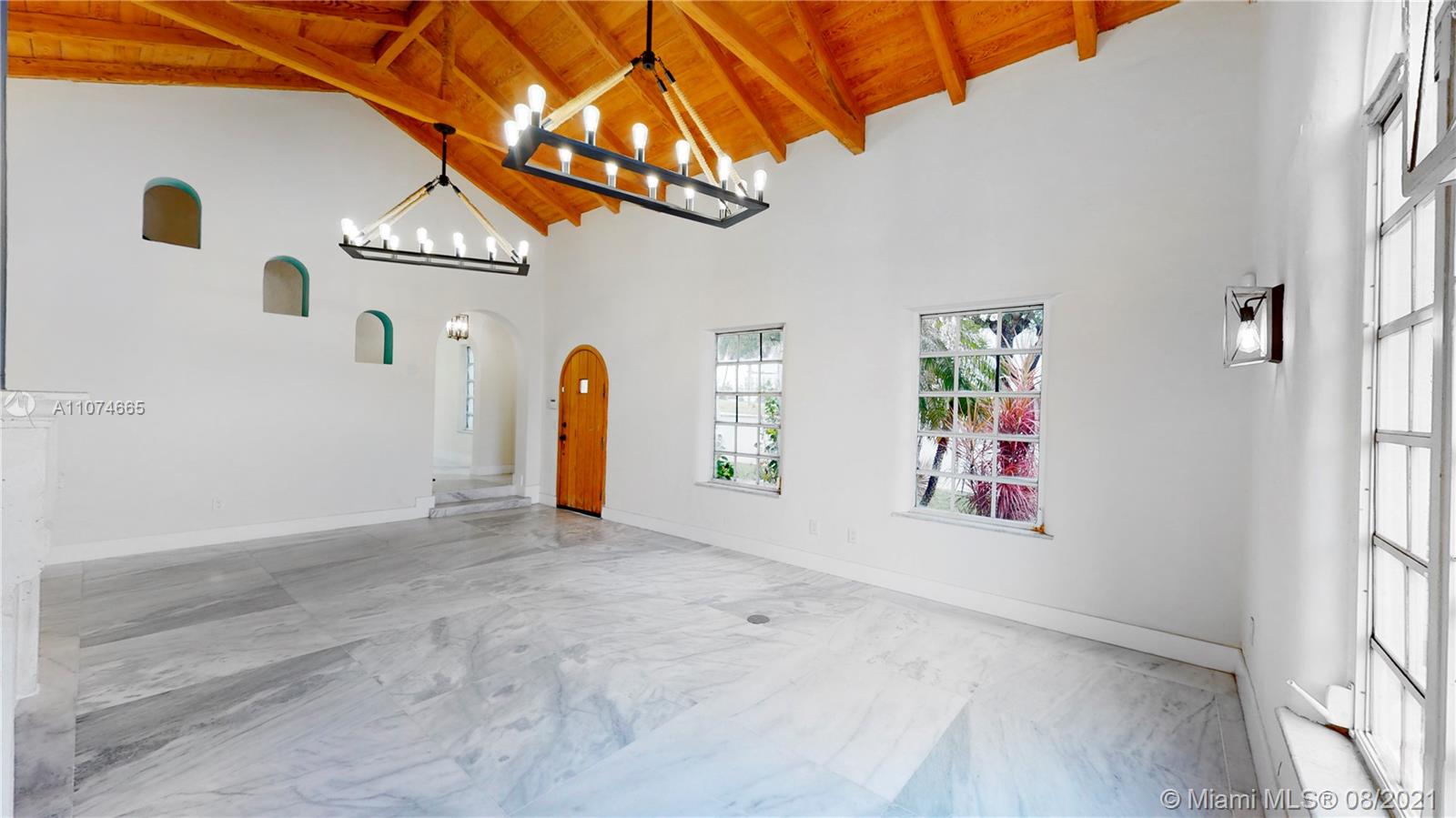 2032 Alton Road Miami Beach, FL 33140 - Photo 14 of 35 a view of a livingroom with a garage