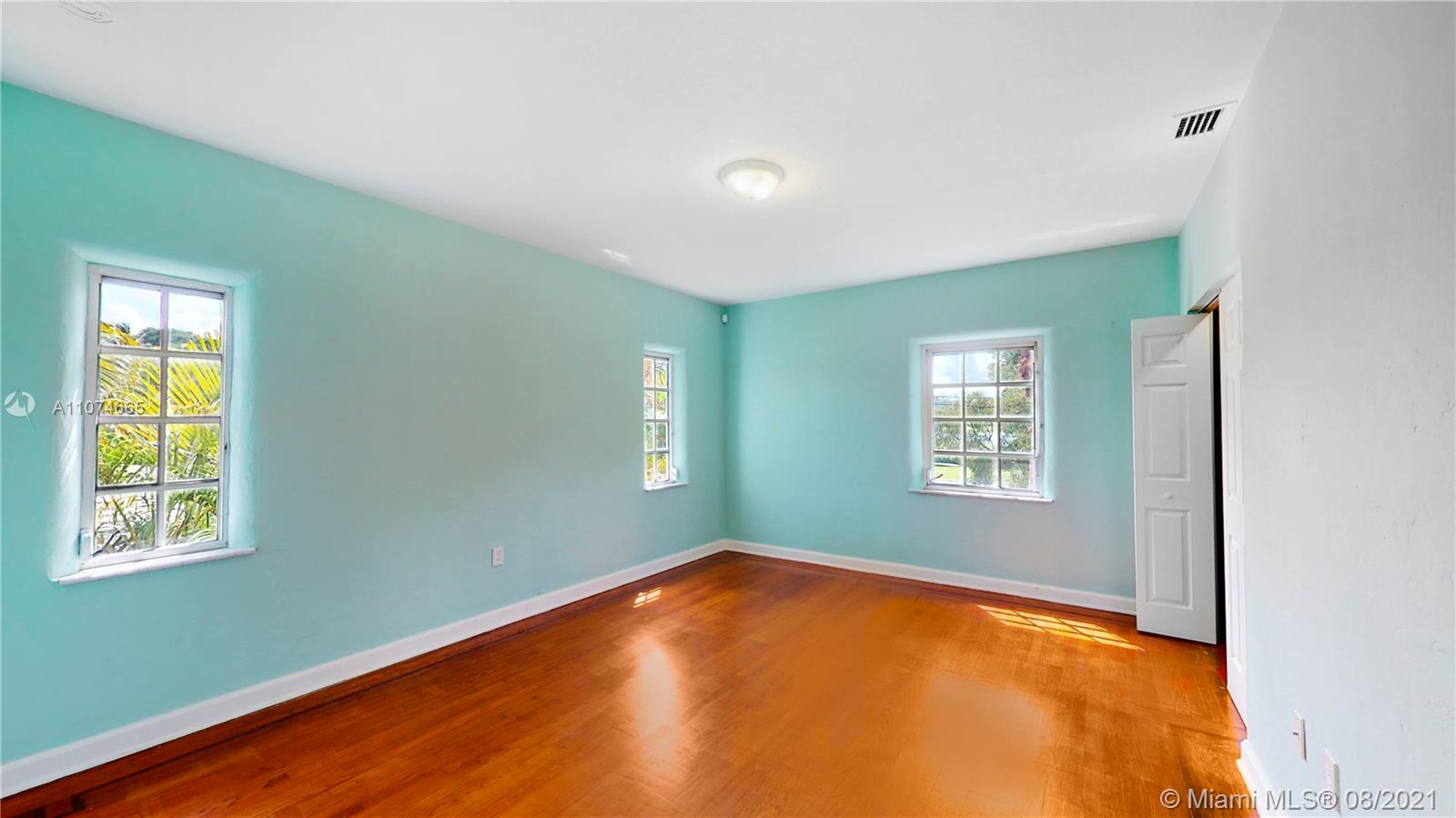 2032 Alton Road Miami Beach, FL 33140 - Photo 17 of 35 a view of an empty room with a window