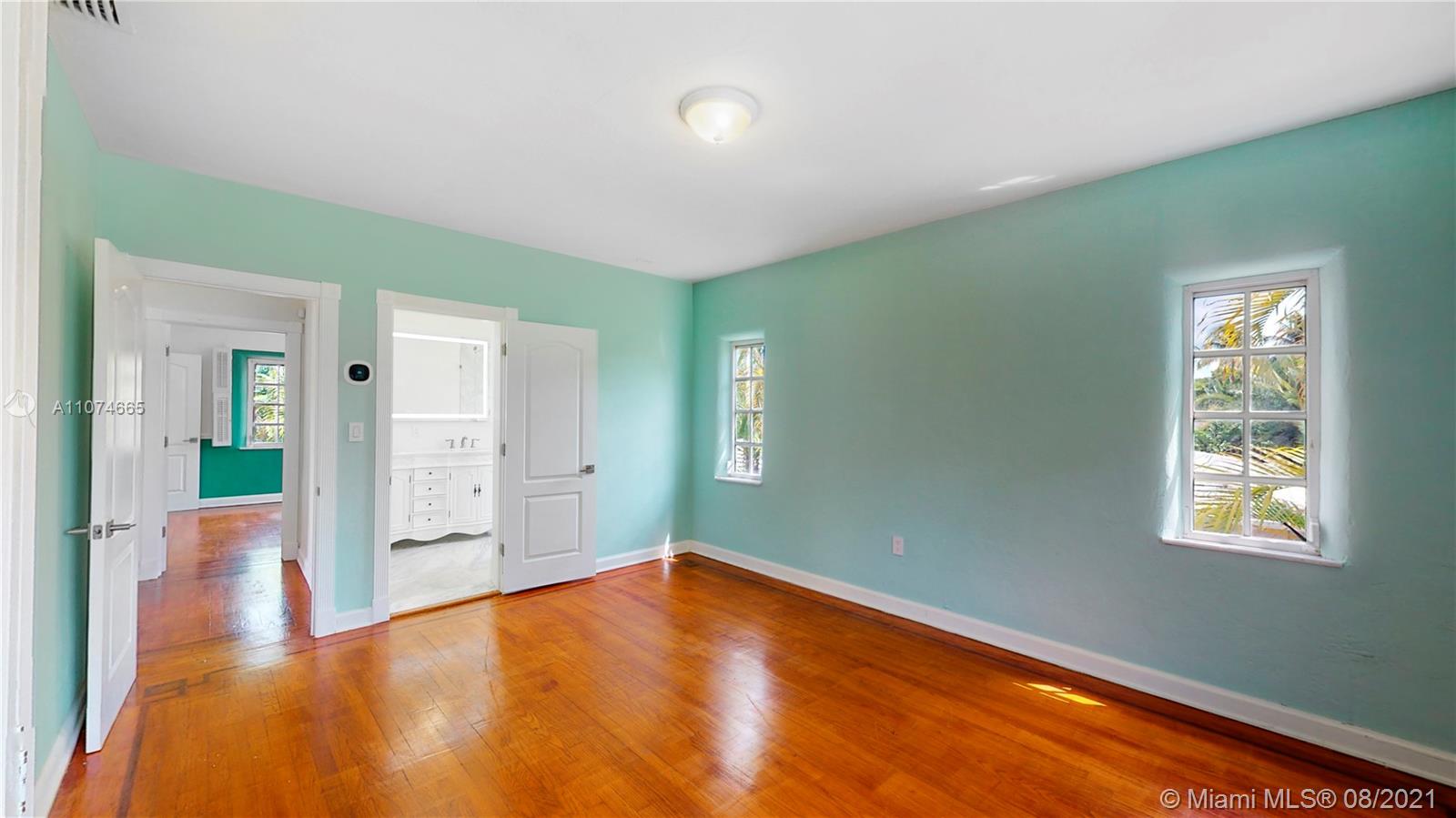 2032 Alton Road Miami Beach, FL 33140 - Photo 18 of 35 a view of empty room with wooden floor