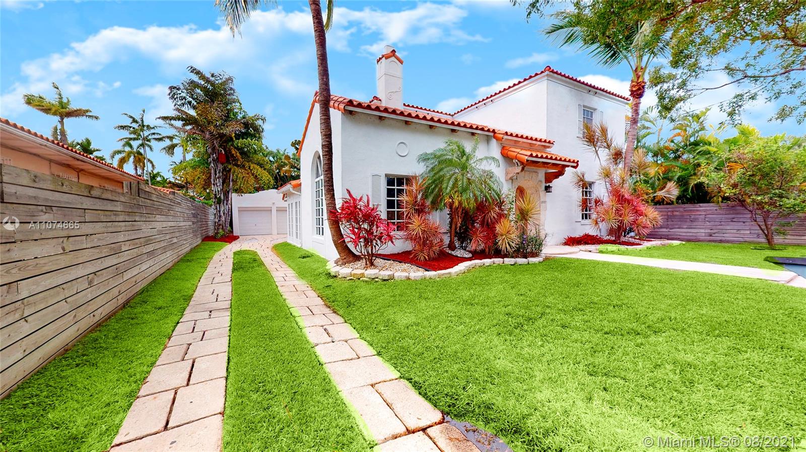 2032 Alton Road Miami Beach, FL 33140 - Photo 3 of 35 a view of a backyard with a garden and plants