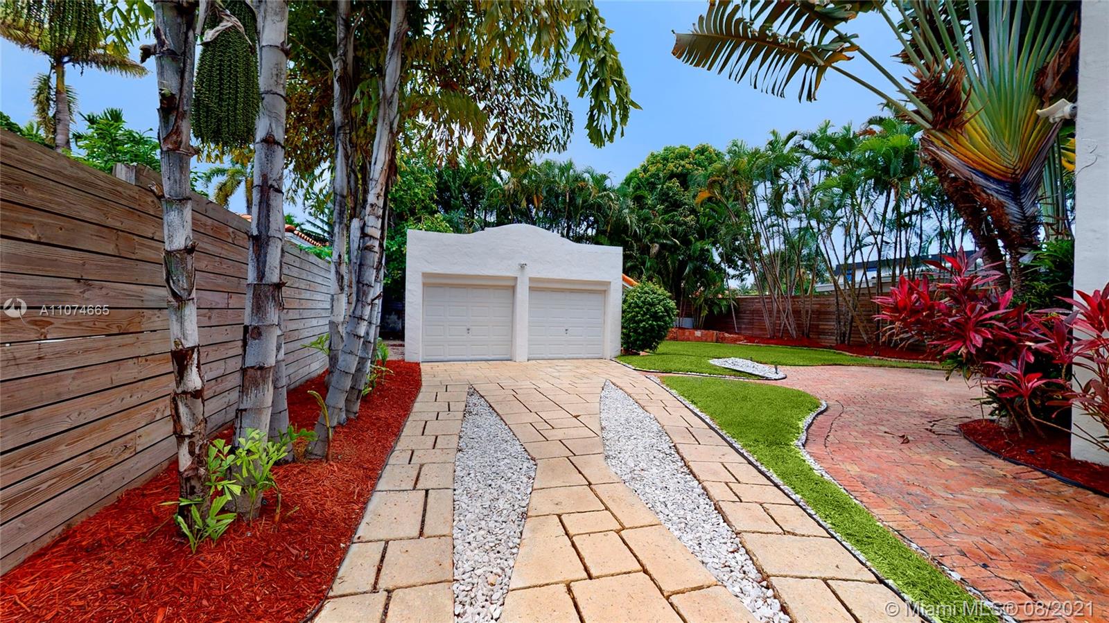 2032 Alton Road Miami Beach, FL 33140 - Photo 27 of 35 a backyard of a house with outdoor seating