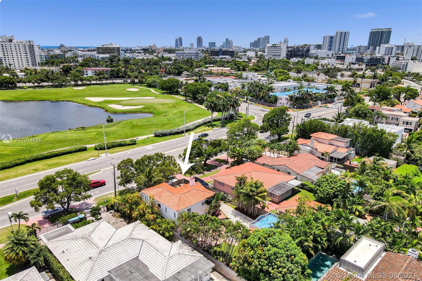 2032 Alton Road Miami Beach, FL 33140 - Photo 31 of 35 an aerial view of a city with lots of residential buildings ocean and mountain view in back
