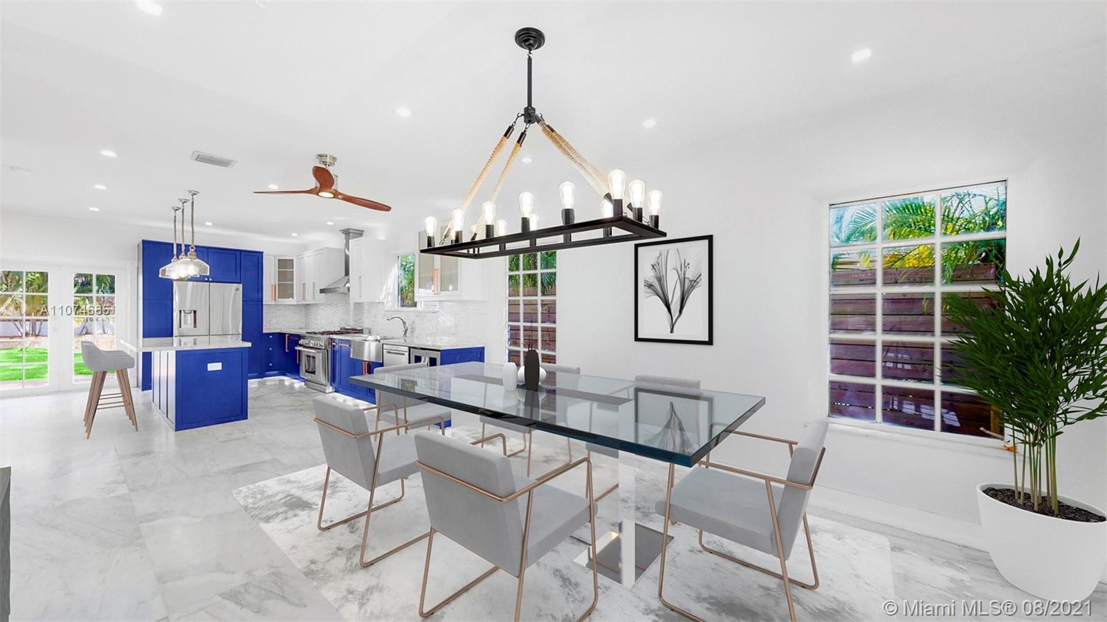 2032 Alton Road Miami Beach, FL 33140 - Photo 5 of 35 a view of a dining room with furniture and potted plants