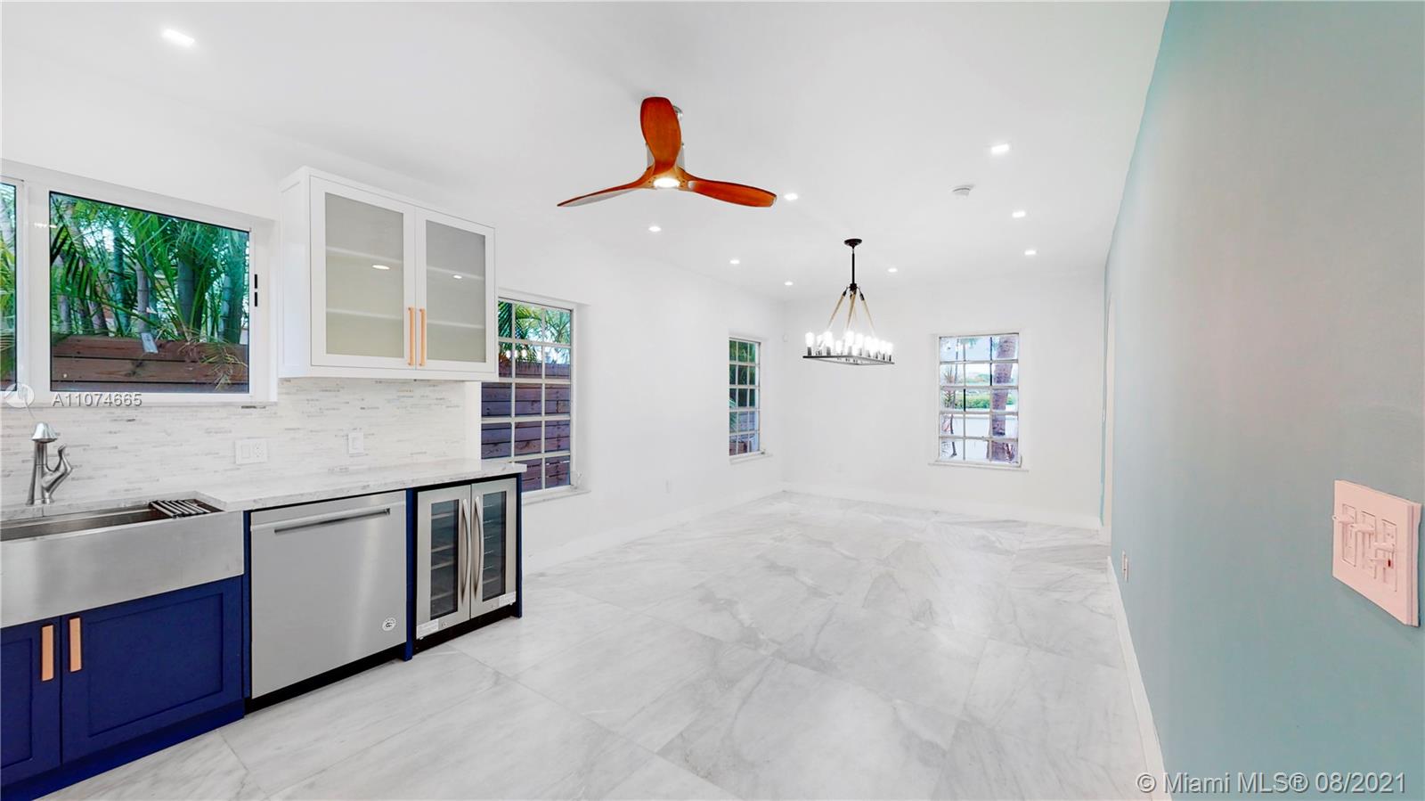 2032 Alton Road Miami Beach, FL 33140 - Photo 7 of 35 a kitchen with stainless steel appliances granite countertop a sink and a stove