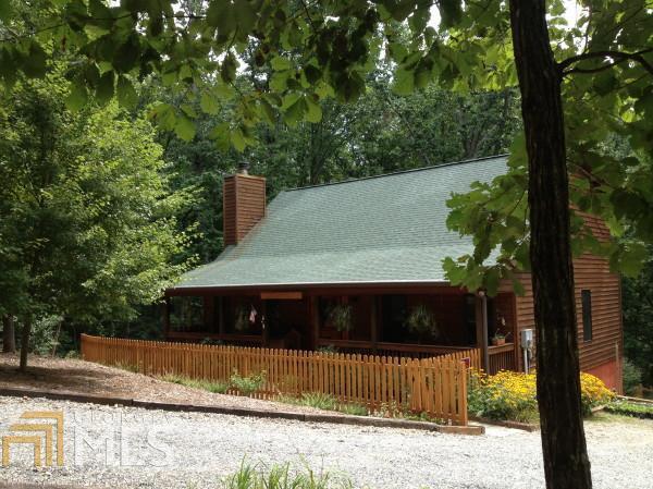 579 Washboard Road, Unit 6 Cleveland, GA 30528 - Photo 1 of 1 a view of a yard with potted plants and large trees