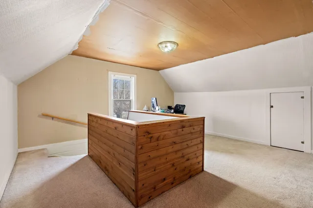 a view of room with cabinet and stairs
